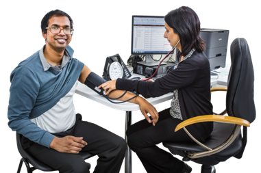 A man having his blood pressure taken by a GP.