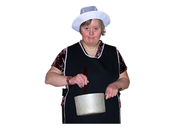A woman wearing an apron and cooks hat stirring a pan.