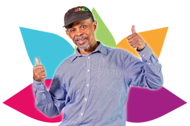 A man looking happy giving thumbs up